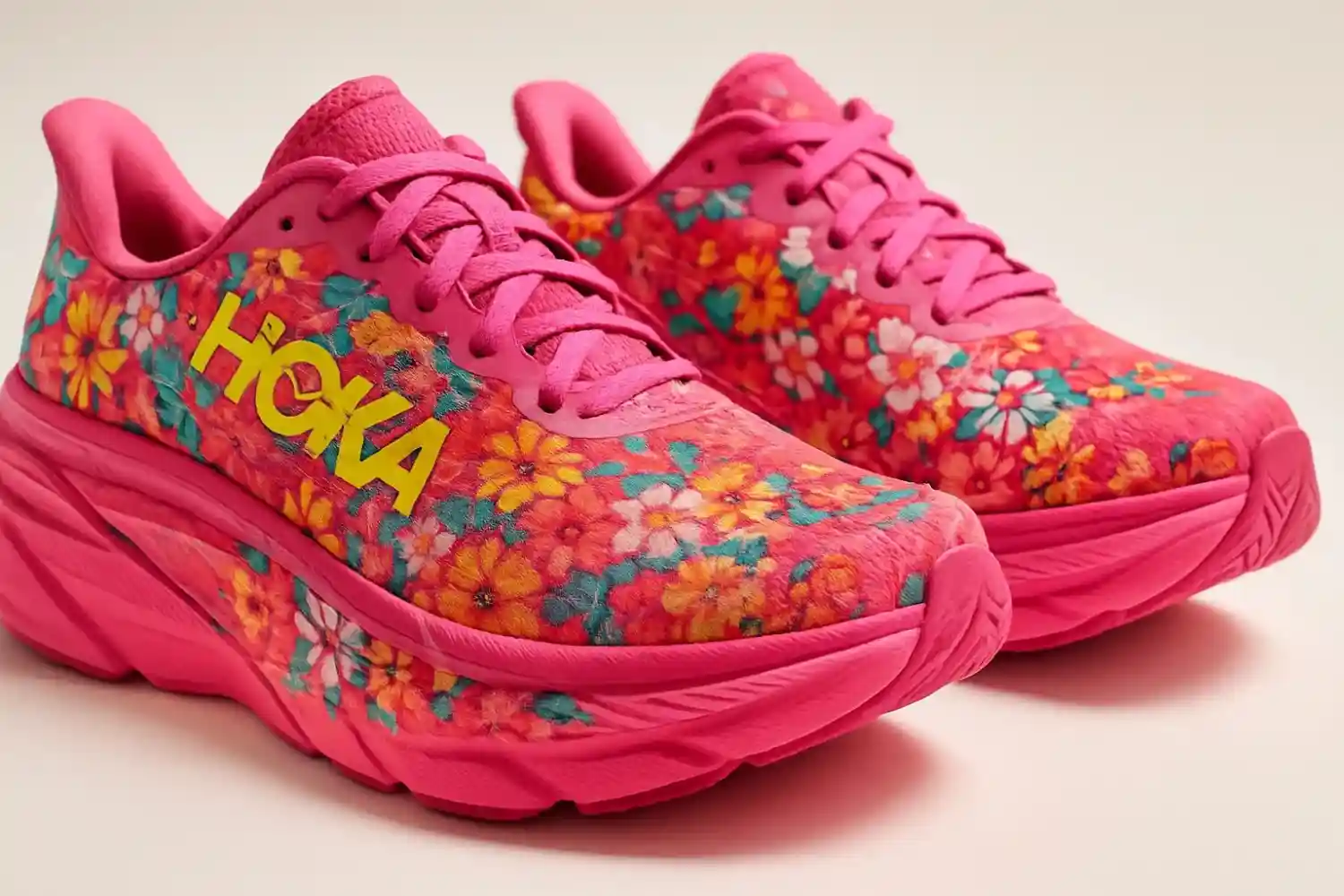 Colorful Hoka shoes in pink and floral designs, showcasing the brand’s stylish and vibrant appeal.